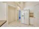 White kitchen with refrigerator and pantry at 4072 Fairway Pl, North Port, FL 34287