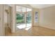 Living room features sliding glass doors opening to a screened patio at 4072 Fairway Pl, North Port, FL 34287