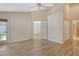 Spacious bedroom with wood-look floors and access to bathroom and other bedroom at 4072 Fairway Pl, North Port, FL 34287