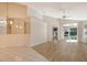 Spacious living room with vinyl flooring and access to a screened patio at 4072 Fairway Pl, North Port, FL 34287
