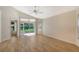 Bright living room with vinyl plank flooring and sliding glass doors at 4072 Fairway Pl, North Port, FL 34287