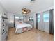 Spacious bedroom with light gray furniture and ceiling fan at 2420 Foster Ln, Sarasota, FL 34239