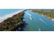 Peaceful waterway with boats and lush greenery at 6772 Greenview Ln, Englewood, FL 34224