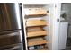 Open kitchen cabinets with ample storage space at 6772 Greenview Ln, Englewood, FL 34224