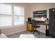 Home office with a desk, chair, file cabinet, and window with shutters at 6772 Greenview Ln, Englewood, FL 34224