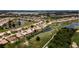 Community overview with houses, lakes, and golf course at 6772 Greenview Ln, Englewood, FL 34224