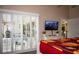 Bedroom with a king-size bed and sliding doors to the patio at 6772 Greenview Ln, Englewood, FL 34224