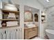 Elegant bathroom with a vintage vanity and a soaking tub at 12307 S Access Rd, Port Charlotte, FL 33981