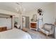 Cozy bedroom with a queen-size bed, dresser, and a charming sitting area at 12307 S Access Rd, Port Charlotte, FL 33981