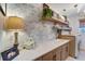 Laundry room with stylish cabinets and a farmhouse sink at 12307 S Access Rd, Port Charlotte, FL 33981