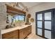 Butler's pantry with quartz countertops, custom cabinetry, and a view to the backyard at 12307 S Access Rd, Port Charlotte, FL 33981