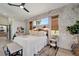 Bright bedroom with a queen-size bed, decorative wall, and plenty of natural light at 12307 S Access Rd, Port Charlotte, FL 33981