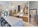 Spacious kitchen with light wood cabinets, quartz countertops, and high-end appliances at 12307 S Access Rd, Port Charlotte, FL 33981