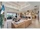 Open-concept living room with a stylish chandelier and fireplace at 12307 S Access Rd, Port Charlotte, FL 33981