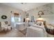 Charming bedroom with two twin beds, a chandelier, and a view at 12307 S Access Rd, Port Charlotte, FL 33981