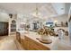 Bright and airy kitchen with a large island, ample counter space, and stylish light fixtures at 12307 S Access Rd, Port Charlotte, FL 33981