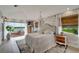 Large bedroom with a plush bed and access to a private deck at 12307 S Access Rd, Port Charlotte, FL 33981