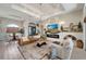 Spacious living area with a fireplace and large windows at 12307 S Access Rd, Port Charlotte, FL 33981