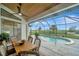 Relaxing pool and patio area with seating at 12307 S Access Rd, Port Charlotte, FL 33981