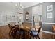 Elegant dining room features hardwood floors and a chandelier at 4529 Golden Gate Cv, Bradenton, FL 34211