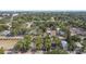 Wide aerial view of neighborhood, featuring lush trees and houses at 1611 Ballard Park Dr, Bradenton, FL 34205