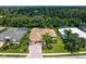 Single-Gathering home with tile roof, driveway, and landscaping at 6747 Coyote Ridge Ct, Bradenton, FL 34201