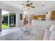 Open concept kitchen and Gathering room with light wood cabinets and breakfast bar at 6747 Coyote Ridge Ct, Bradenton, FL 34201