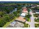 Aerial view of a house with pool, located in a peaceful, residential neighborhood at 6747 Coyote Ridge Ct, Bradenton, FL 34201