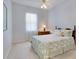 Cozy bedroom with leafy green bedding and window with sheer curtains at 6747 Coyote Ridge Ct, Bradenton, FL 34201