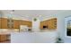 Spacious kitchen with light wood cabinets and a large island at 6747 Coyote Ridge Ct, Bradenton, FL 34201