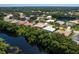 Community overview showcasing houses, lush landscape, and waterway at 6747 Coyote Ridge Ct, Bradenton, FL 34201