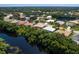 Community overview showcasing houses, lush landscape, and waterway at 6747 Coyote Ridge Ct, Bradenton, FL 34201