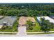 Single-Gathering house with tile roof, driveway, and landscaping at 6747 Coyote Ridge Ct, Bradenton, FL 34201