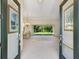 Bright and spacious entryway with double doors leading into the main living area at 6747 Coyote Ridge Ct, Bradenton, FL 34201