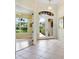 Elegant entryway with double doors, tile flooring, and access to other rooms at 6747 Coyote Ridge Ct, Bradenton, FL 34201
