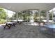 Covered outdoor patio with picnic tables and seating at 6747 Coyote Ridge Ct, Bradenton, FL 34201