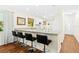 Kitchen with breakfast bar, granite countertops and white cabinets at 2310 Lark Ln # 22, Sarasota, FL 34231