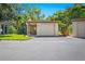 Front exterior view showing a garage and landscaping at 2310 Lark Ln # 22, Sarasota, FL 34231