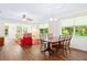 Charming dining area with a wood table and four chairs, overlooking the backyard at 2310 Lark Ln # 22, Sarasota, FL 34231