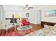 Bright living room with comfy seating, a large TV, and hardwood floors at 2310 Lark Ln # 22, Sarasota, FL 34231