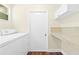 Laundry room with washer, dryer, and extra storage at 2310 Lark Ln # 22, Sarasota, FL 34231