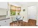 Kitchen nook with glass-top table and chairs near window at 2310 Lark Ln # 22, Sarasota, FL 34231