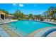 Inviting community pool with plenty of lounge chairs at 2310 Lark Ln # 22, Sarasota, FL 34231