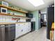 Well-equipped kitchen featuring white cabinets and stainless steel appliances at 5026 Water Oak Dr # 119, Bradenton, FL 34207