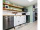 Well-equipped kitchen featuring white cabinets and stainless steel appliances at 5026 Water Oak Dr # 119, Bradenton, FL 34207