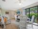 Bright dining area with sliding glass doors and a view of the patio at 5026 Water Oak Dr # 119, Bradenton, FL 34207