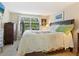 Main bedroom with king-size bed, dresser, and window with blinds at 5026 Water Oak Dr # 119, Bradenton, FL 34207