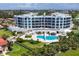 Modern condo building with pool and ocean access at 2251 Gulf Of Mexico Dr # 301, Longboat Key, FL 34228