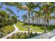 Landscaped walkway through tropical gardens at 2251 Gulf Of Mexico Dr # 301, Longboat Key, FL 34228
