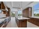 Gourmet kitchen with island, custom cabinetry, and high-end appliances at 2251 Gulf Of Mexico Dr # 301, Longboat Key, FL 34228